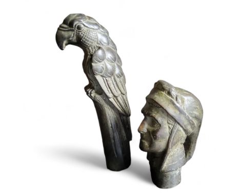 A novelty bronze walking stick handle, as a parrot, 13cm high;&nbsp; another, Dante, 7.5cm high (2) 