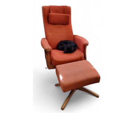 An Ercol Gina swivel recliner arm chair and foot stool, upholstered in burnt orange, 2006 