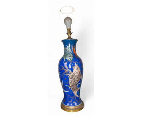 Chinese A late Qing period baluster vase. Decorated with carps on a blue ground background. Converted to a modern lamp  Dimen
