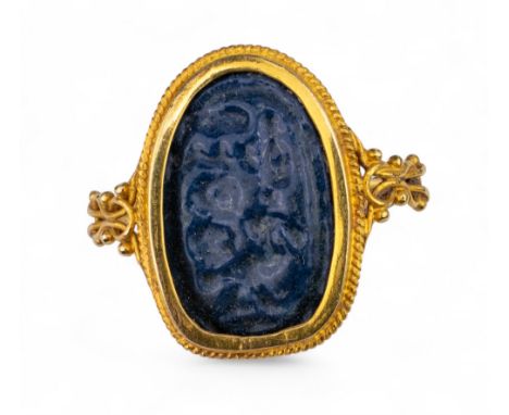 Continental, Antique An ancient blue glass intaglio-style panel (possibly Egyptian) within a high carat gold rope-twist and l