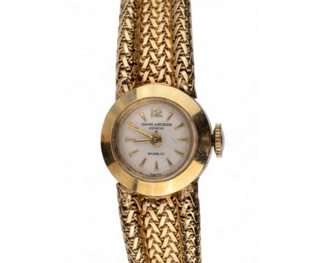Baume &amp; Mercier, circa 1960s A ladies' Incabloc 14ct gold bracelet watch. The circular dial on a woven herringbone mesh l