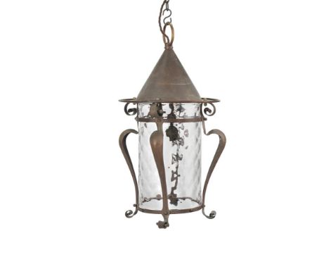 AN ARTS AND CRAFTS GILT COPPER LANTERN  CIRCA 1900-1910  Conical shade above spiral twist glass drum within scrolling frame 5