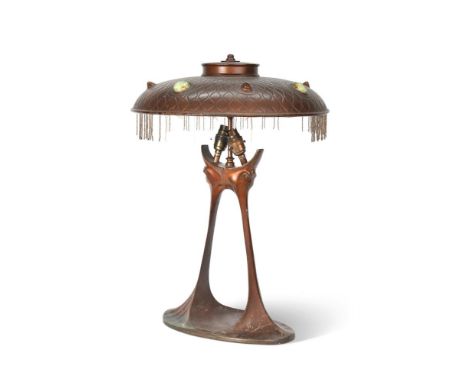 A CONTINENTAL JUGENDSTIL OR ART NOUVEAU COPPERED TABLE LAMP AND SHADE  LATE 19TH CENTURY  Rewired and PAT tested  57cm high, 