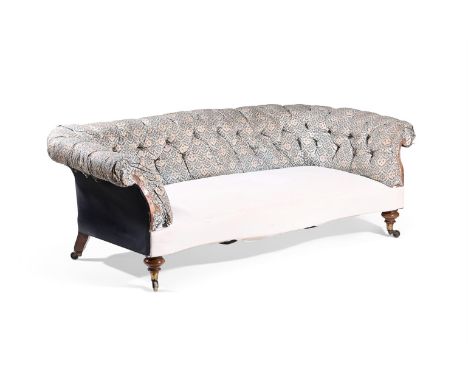 AN EARLY VICTORIAN WALNUT SERPENTINE FRONTED 'CHESTERFIELD' SOFA BY HOWARD & SONS, MID 19TH CENTURY Upholstered in the origin