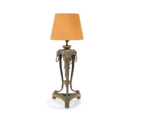 A BRASS TABLE LAMP IN THE NEOCLASSICAL TASTE  19TH OR EARLY 20TH CENTURY With lion or panther mask headed cabriole supports, 