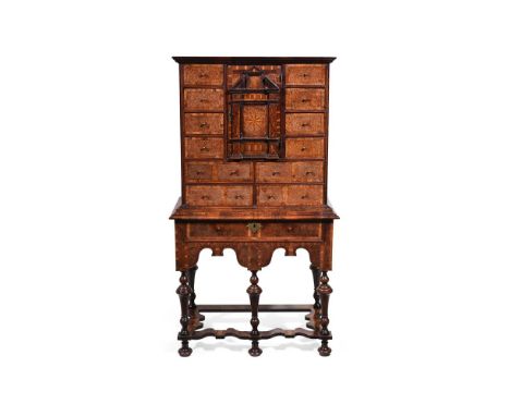 A FINE AND RARE WILLIAM & MARY YEW, BURR YEW AND WALNUT CROSSBANDED CABINET ON STAND CIRCA 1690 143.5cm high, 79cm wide, 44.5