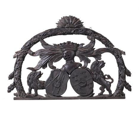 A DUTCH CARVED WOOD AND EBONISED HERALDIC COAT OF ARMS  19TH CENTURY  88cm high, 130cm wideIt has been suggested that this co