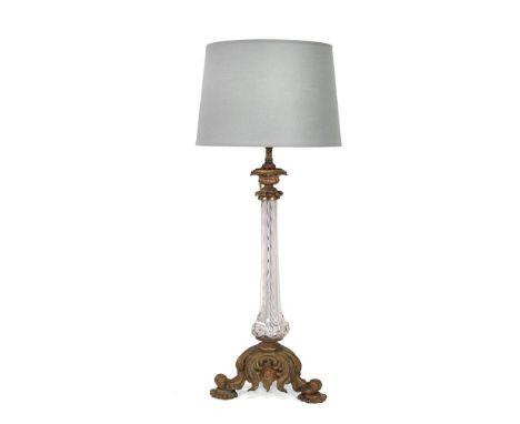 A GILT BRASS MOUNTED GLASS COLUMN TABLE LAMP  EARLY 19TH CENTURY  Ornate scrolling base, rewired and PAT tested, with shade  