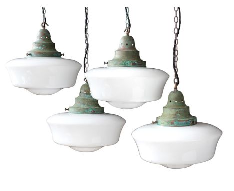 A SET OF FOUR 'THE CAPEL BACH' VERDIGRIS METAL AND OPALINE GLASS PENDANT LIGHTS BY DREW PRITCHARD LTD Wired and PAT tested ea