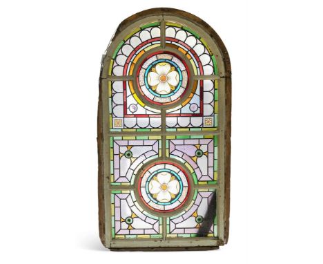 A LARGE VICTORIAN STAINED GLASS WINDOW  SECOND HALF 19TH CENTURY  Set within a white painted timber frame of architectural fo