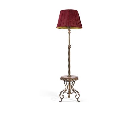 A BRASS STANDARD LAMP  MID 19TH CENTURY  With basket top above small table tier base on pierced scrolling supports, rewired a