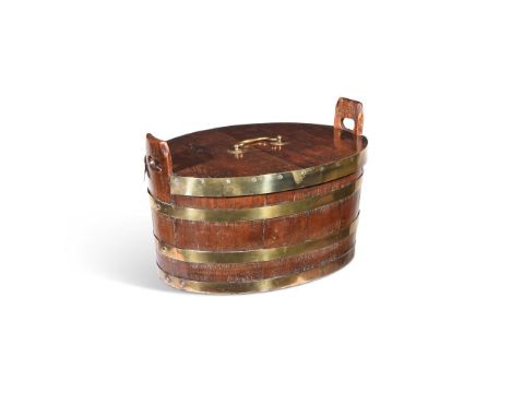 A GEORGE III BRASS BOUND OAK LIDDED PLANTER OR BUCKET  LATE 18TH OR EARLY 19TH CENTURY  The removable lid opening to a zinc l
