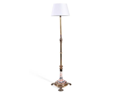 AN AESTHETIC MOVEMENT STANDARD LAMP  LATE 19TH CENTURY  With gilt brass collared stem and Imari decorated ceramic set base in