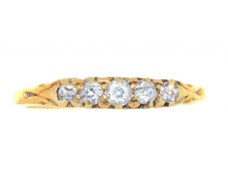 A DIAMOND FIVE STONE RING IN GOLD, INDISTINCTLY MARKED, 2.4G, SIZE K++BUILD UP OF DIRT AND GRIME