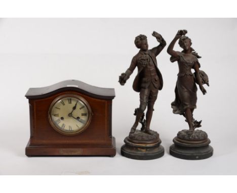 A PAIR OF FRENCH FIN DE SIECLE BRONZED SPELTER FIGURES OF A YOUTH AND GIRL WITH FLOWERS, 46CM H AND A MAHOGANY MANTEL CLOCK W