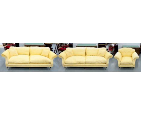 A THREE PIECE SUITE UPHOLSTERED IN YELLOW FABRIC, COMPRISING TWO SOFAS AND AN ARMCHAIR, SOFA 225CM W