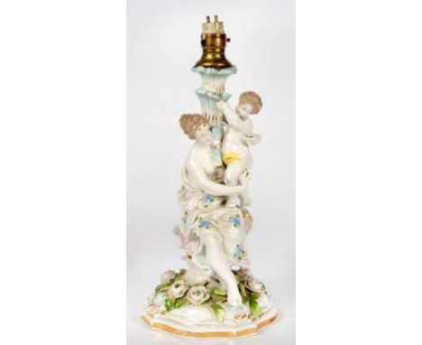 A GERMAN FLORAL ENCRUSTED PORCELAIN VENUS-AND-CUPID FIGURAL STAND ADAPTED AS A LAMP, 30CM H, EXCLUDING FITMENT, LATE 19TH C