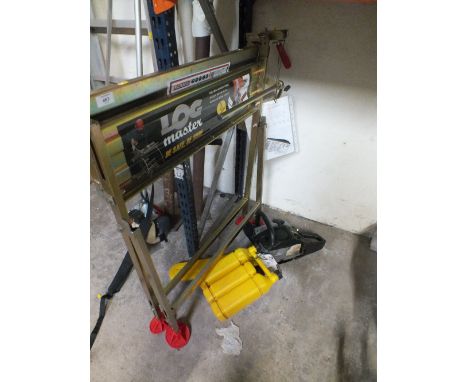 A LOG MASTER CUTTING TABLE TOGETHER WITH A McCULLOCH CHAINSAW