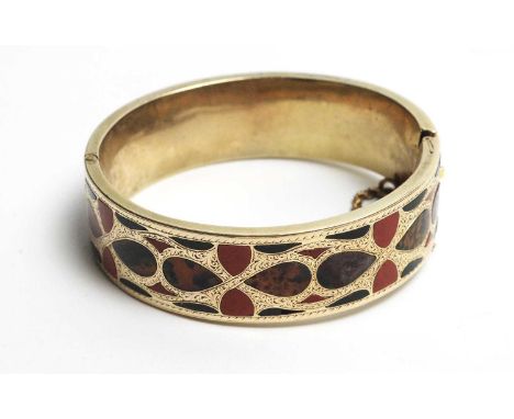 A Victorian Scottish hardstone bangle, with shaped stones of moss agate, bloodstone and others, in yellow metal mount with en