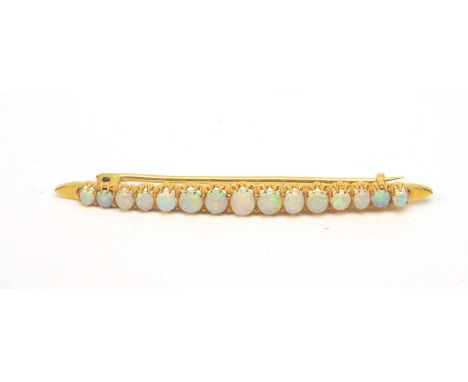 An opal bar brooch, the fifteen graduated oval opal cabochons in yellow metal mount, 6.5cms wide, 5.4g gross.