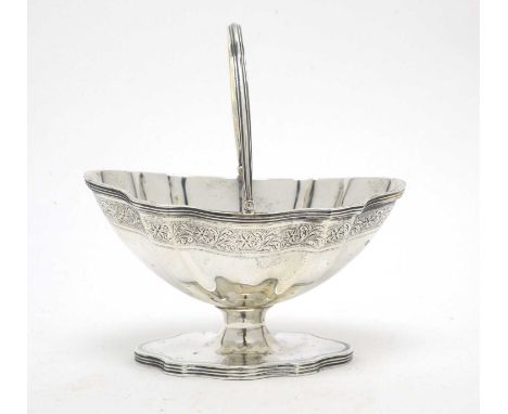 An Edwardian silver sugar basket, by R. &amp; S. Garrard &amp; Co., London 1907, of shaped oval form with reeded handle and r