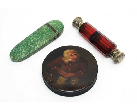 A 19th Century hand-painted Stobwasser-style circular box, decorated with a Tax Collector with a bag of money, 10cms diameter