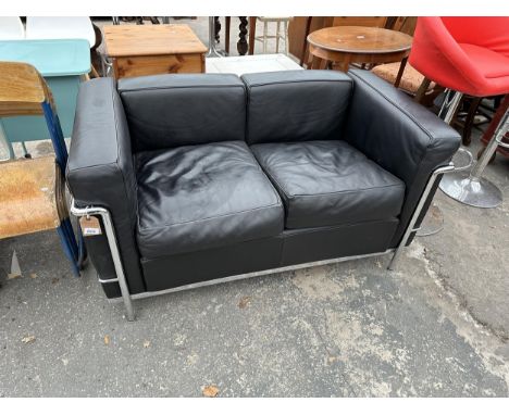 A BLACK LEATHER TWO SEATER CASSINA LC2 SOFA ON POLISHED CHROME FRAME&nbsp;BEARING SERIAL NUMBER LC2 131248