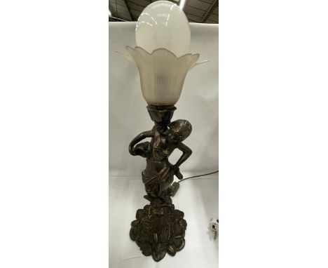 A BRASS FIGURAL TABLE LAMP AND SHADE 