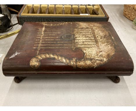 A VINTAGE STAND WITH PAW FEET DESIGN 