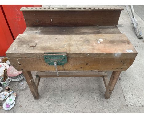 A CHILDS WOODEN WORK BENCH WITH WOOD VICE 