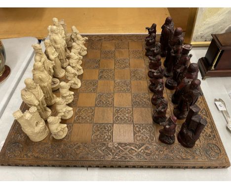 A VERY LARGE AND COMPLETE ROBIN HOOD RESIN CHESS SET WITH PIECES UP TO AND OVER 15CM TALL, COMPLETE WITH 60 X 60CM BOARD 