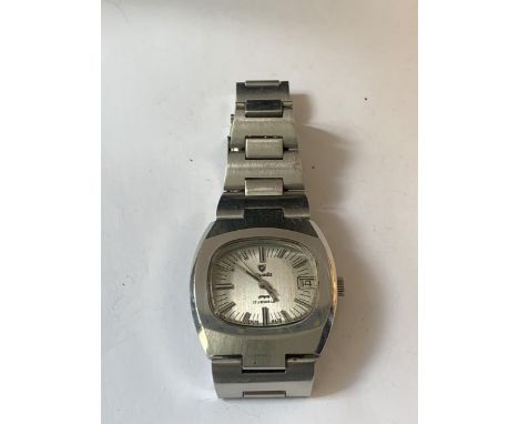 A VINTAGE NIVADA WRIST WATCH WITH ORIGINAL BRACELET. MANUAL SEEN WORKING BUT NO WARRANTY 
