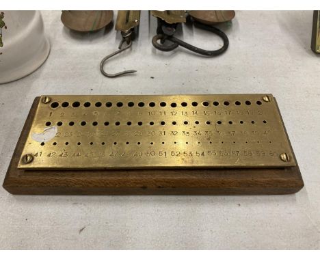 A VINTAGE BRASS AND WOOD CRIBBAGE BOARD 
