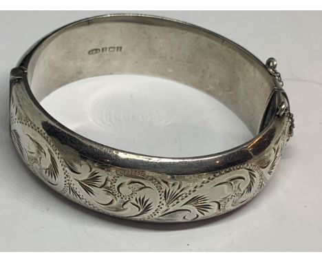 A HEAVY SILVER BANGLE 