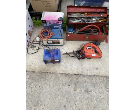 AN ASSORTMENT OF TOOLS TO INCLUDE BATTERY CHARGERS, SCREW DRIVERS AND A BLACK AND DECKER POWER SAW ETC 
