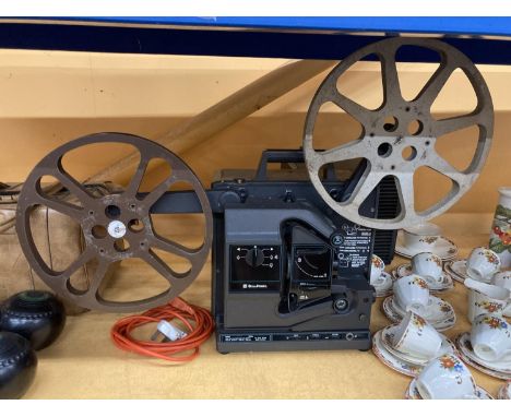 A VINTAGE BELL &amp; HOWELL FILM PROJECTOR WITH A 16MM FILMOSOUND 