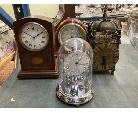 A VINTAGE BRASS LANTERN CLOCK, A CARRIAGE CLOCK AND TWO WOODEN MANTLE CLOCKS 