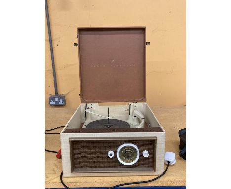 A KB RADIO TUNETIME VINTAGE RECORD PLAYER IN A CASE 