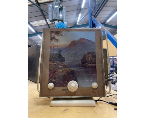 A VINTAGE MAIRAL RADIO WITH A RIVER AND MOUNTAIN SCENE TO THE FRONT 