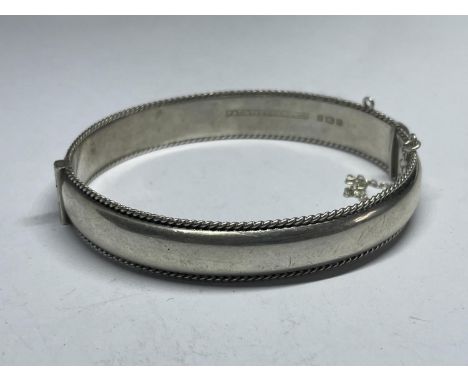 A HALLMARKED BIRMINGHAM SILVER BANGLE WEIGHT 15.8 GRAMS 