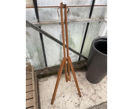 A WOODEN FOLDING TRIPOD ARTISTS EASLE 
