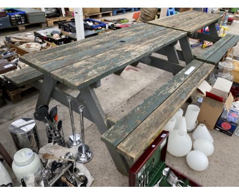 A WOODEN PICNIC BENCH 