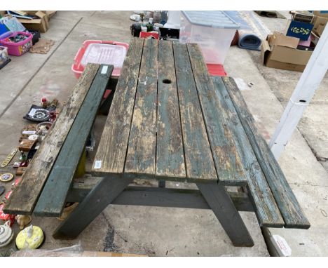 A WOODEN PICNIC BENCH 