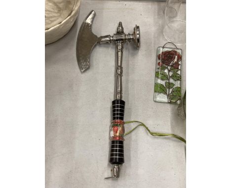 AN ORNATE HANG UP STEAM PUNK AXE 