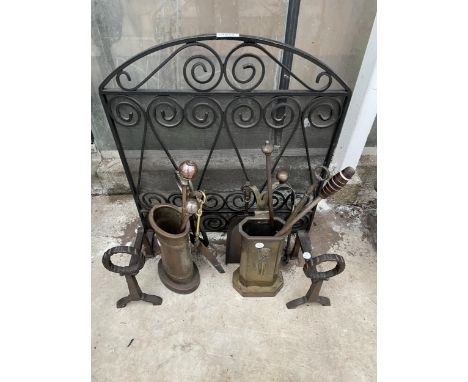 AN ASSORTMENT OF FIRESIDE ITEMS TO INCLUDE A FIRE SCREEN, COMPANION SETS AND A PAIR OF FIRE DOGS ETC 