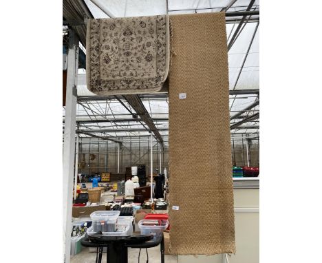 A SMALL CREAM PATTERNED RUG AND A CARPET RUNNER 