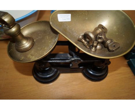 Brass scales on weights