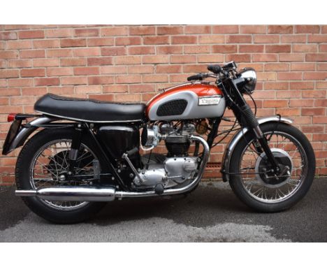 A 1969 Triumph Bonneville, registration number VRX 65H, frame number HC23306, engine number DM65041242, red and grey.  This r