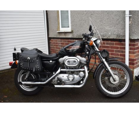 A 1999 Harley-Davidson Sportster 883, registration number T504 JGT, black.  This Harley has been in storage since its last MO