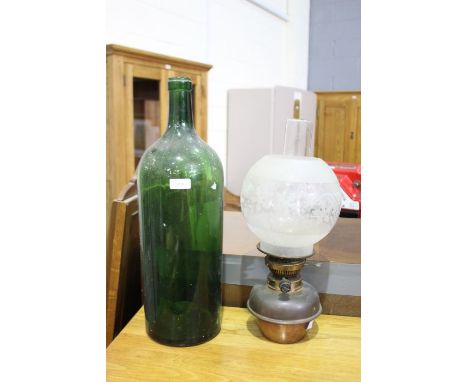 Large green glass bottle, 50cm tall, and a copper oil lamp, with frosted glass shade (2)